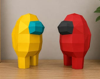 May include: Two low-poly figurines standing side by side. One figurine is bright yellow with a teal visor, and the other is vibrant red with a black visor. Both figures have a geometric, faceted surface texture and a rounded, upright body shape.
