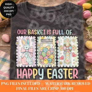 May include: Dark gray t-shirt with a colorful Easter design. The design includes a bunny, a jar of Easter eggs, and a cross, with the text "OUR BASKET IS FULL OF.. HAPPY EASTER".