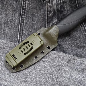 May include: A green and black knife with a plastic sheath. The sheath has a belt loop and multiple holes for attaching to a belt.