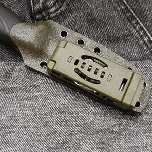 May include: A green knife sheath with a black knife handle. The sheath has a clip on the back and a series of holes for attaching to a belt.