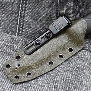 May include: A green knife sheath with a black clip and multiple holes for attaching to a belt. The sheath is made of a textured material and has a smooth finish.