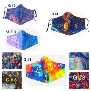 May include: Eight different fabric face masks with various galaxy and space-themed prints. The masks are labeled with numbers 1 through 8. Some masks feature planets, stars, and constellations. Others have a swirling, abstract design.