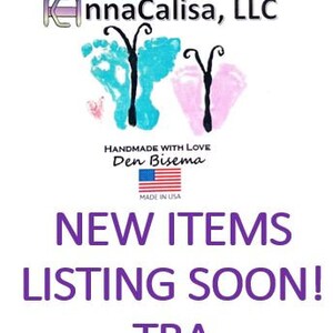 May include: A white background with a blue and pink butterfly design. The text "AnnaCalisa, LLC" is at the top of the image. The text "Handmade with Love Den Bisema" is in the middle of the image. The text "Made in USA" is below the text "Den Bisema". The text "NEW ITEMS LISTING SOON! TBA" is at the bottom of the image.