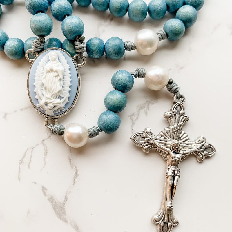 Our Lady of Guadalupe cameo rosary by Refuge Rosaries made with blue wood beads, pearl beads, and micro cord | Catholic gift