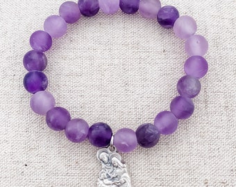 Catholic bracelet made with matte amethyst beads, stretch cord, and a Holy Family charm | Advent bracelet | Catholic gift