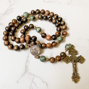 Saint Joseph rosary beads by Refuge Rosaries with ebony wood beads, micro cord, bronze medals, and turquoise gemstones | Paracord rosary