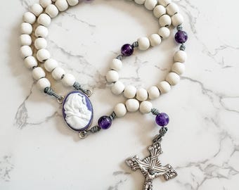 Wood and gemstone bead Catholic rosary by Refuge Rosaries with Madonna of the Streets cameo, white beads, amethyst beads, and micro cord