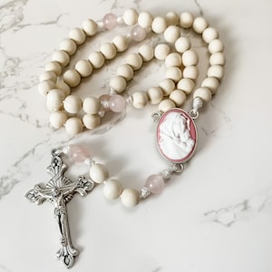 Catholic rosary with pink Madonna of the Streets cameo, white wood beads, rose quartz beads, and micro cord | Catholic gift