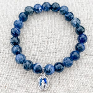 Catholic bracelet made with blue sodalite gemstone beads, stretch cord, and a tiny blue enamel Miraculous Medal | Catholic gift