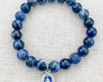 Catholic bracelet made with blue sodalite gemstone beads, stretch cord, and a tiny blue enamel Miraculous Medal | Catholic gift