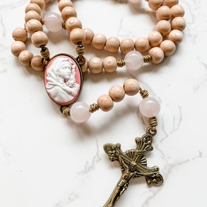 Handmade Catholic rosary beads by Refuge Rosaries | Virgin Mary cameo centerpiece, rosewood beads, rose quartz beads & cord | Catholic gift