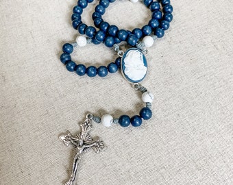 Catholic rosary with dark blue Madonna of the Streets cameo centerpiece, dark blue wood beads and howlite gemstone beads and micro cord