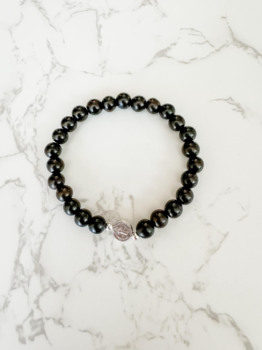 Catholic Stretch Bracelet Made With Ebony Wood Beads and a Saint