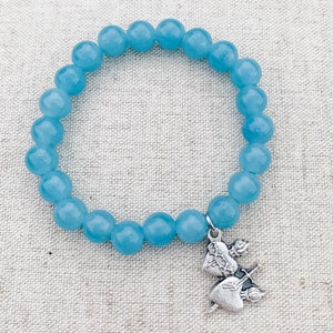 Catholic bracelet made with blue sponge quartz, stretch cord, and an Sacred Heart of Jesus and Immaculate Heart of Mary charm