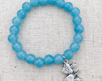 Catholic bracelet made with blue sponge quartz, stretch cord, and an Sacred Heart of Jesus and Immaculate Heart of Mary charm