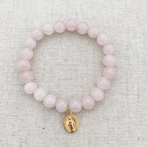 Catholic stretch bracelet made with pink quartz, stretch cord, and a tiny gold-tone Miraculous Medal | Catholic bracelet | Catholic gift