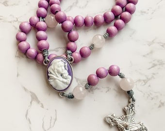 Advent Rosary made with purple wood beads, rose quartz gemstone beads, Madonna of the Streets cameo center, and micro cord