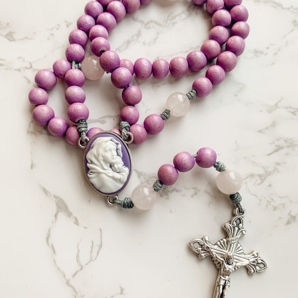 Advent Rosary made with purple wood beads, rose quartz gemstone beads, Madonna of the Streets cameo center, and micro cord