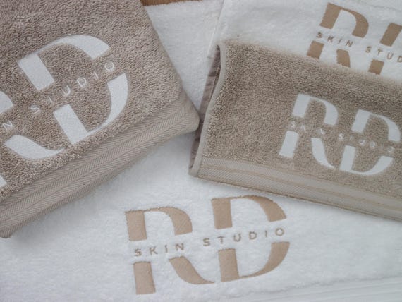 Custom embroidered towels with business logos. Multiple sizes: face cloth, hand towel, bath towel, bath sheet. Multiple colours. UK