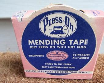 May include: A pink and blue box of Press-On Mending Tape. The box features an illustration of an iron and the text "Just Press On With Hot Iron". The box also states that the tape is "Washproof!" and "Reinforces As It Mends!" and is "Guaranteed by Good Housekeeping".