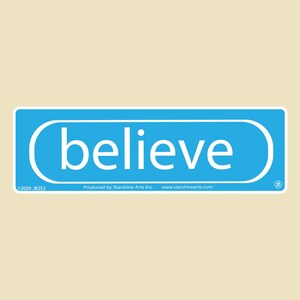 May include: A blue rectangular sign with rounded corners and white text that reads "believe". The sign has a white border and a copyright symbol in the bottom right corner.