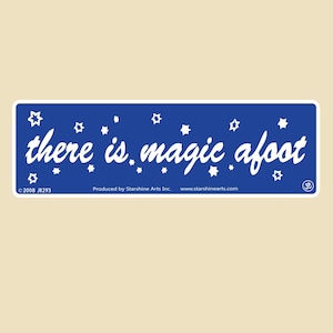 May include: A rectangular sticker with a blue background and white text that reads "there is magic afoot." White stars are scattered around the text. The sticker also includes the text "©2008 JR293" and "Produced by Starshine Arts Inc."