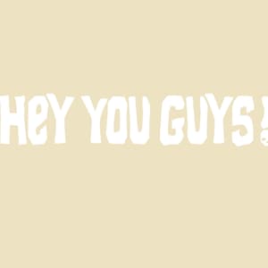 May include: White text on a beige background reads "Hey You Guys!" with a small skull graphic next to the exclamation point.