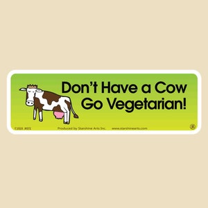 May include: A green and yellow sticker with a cartoon cow and the text "Don't Have a Cow Go Vegetarian!"