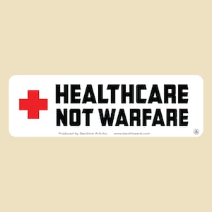 May include: White rectangular sticker with a red cross and the text "Healthcare Not Warfare". The sticker is produced by Starshine Arts Inc. and includes the website www.starshinearts.com.