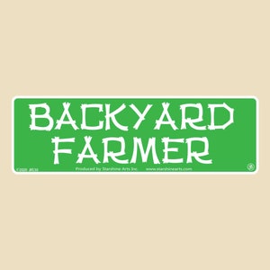 May include: Green sign with white text that reads "BACKYARD FARMER". The sign has a copyright notice and the text "Produced by Starshine Arts Inc. www.starshinearts.com".