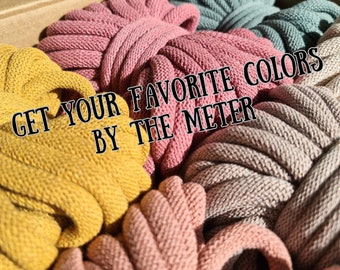 May include: A close-up of a variety of colourful cotton cords, with the text "GET YOUR FAVORITE COLORS BY THE METRE" displayed on top.