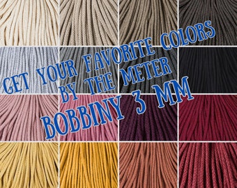 May include: A variety of colours of 3 mm cotton cord, sold by the metre. The text "GET YOUR FAVORITE COLORS BY THE METER BOBBINY 3 MM" is displayed on the image.
