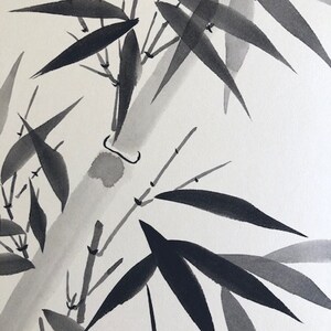 May include: Black and white ink painting of bamboo leaves and stalks. The painting is done in a traditional Japanese style.