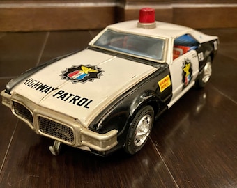 Taiyo Japan 1960s Toronado Oldsmobile battery operated police car Police Department Highway Patrol Car Vintage Tin Toy