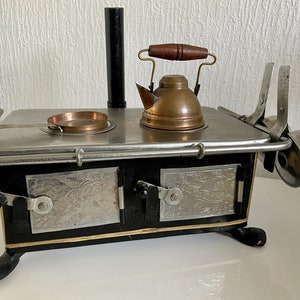Vintage miniature toy stove Working stove top with dishes 50-60s Rare German made cooker Old kitchen stove