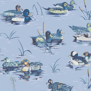 May include: A blue and white patterned fabric with a repeating design of ducks swimming in a pond. The ducks are in various poses, some with their heads up and some with their heads down. The pond is a light blue color and there are reeds and cattails growing in the water.