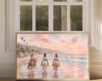 May include: A rectangular framed wall art print featuring a painting of three individuals riding horses along a sandy beach at sunset. The scene includes palm trees on a cliffside, soft pink clouds, and calm ocean waves reflecting the light.