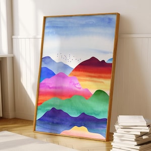 May include: A watercolor painting of colorful mountains with a blue sky and a flock of birds flying overhead. The mountains are painted in shades of blue, purple, pink, orange, yellow, and green.