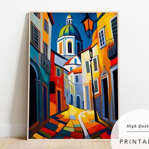 May include: A colourful painting depicting a narrow street in a European city. The street is lined with buildings in shades of yellow, red, blue, and green. A church with a green dome can be seen at the end of the street. The painting is executed in a cubist style.