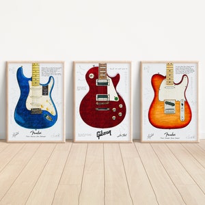Puede incluir: Tres impresiones enmarcadas de guitarras eléctricas. La impresión de la izquierda presenta una Fender Stratocaster azul, la impresión del medio presenta una Gibson Les Paul roja y la impresión de la derecha presenta una Fender Telecaster sunburst.