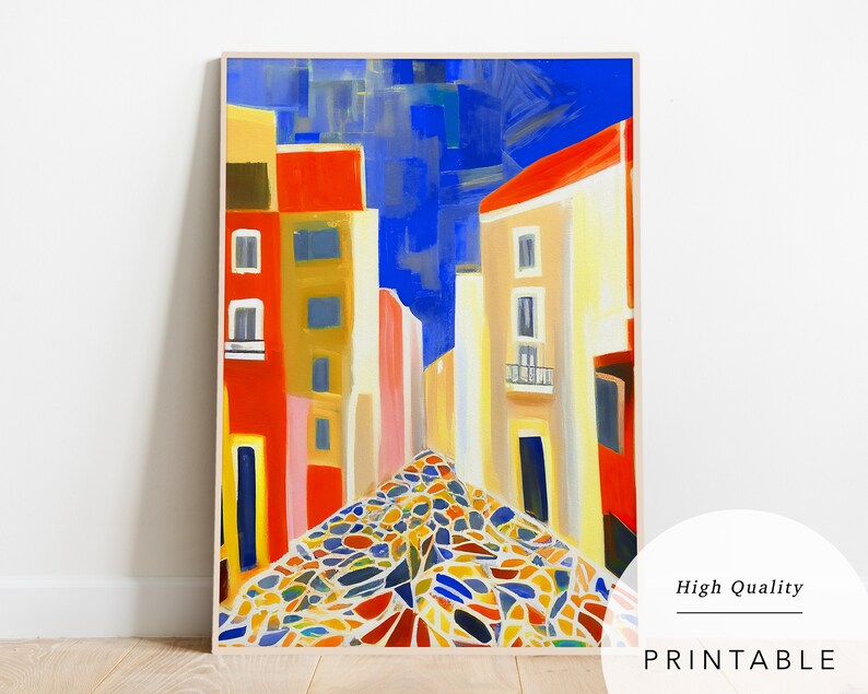 May include: A colourful abstract painting depicting a cobbled street in a European city. The buildings are painted in shades of red, yellow and blue, and the sky is a bright blue. The cobblestones are a mix of colours, including red, yellow, blue, green and white.