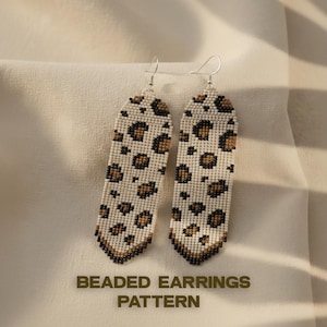 May include: A pair of beaded earrings with a leopard print pattern. The earrings are rectangular with a white background and brown spots. The bottom edge is a dark brown color. The text "BEADED EARRINGS PATTERN" is at the bottom.