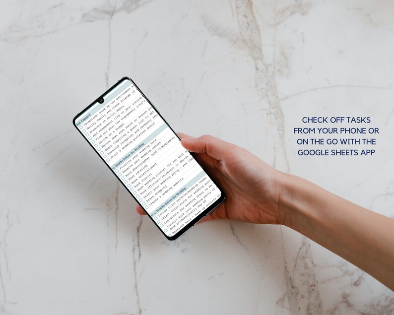 May include: A smartphone displaying a checklist for wedding planning. The checklist includes tasks such as notifying family and close friends, finding a venue, setting a budget, and booking a photographer. The text "CHECK OFF TASKS FROM YOUR PHONE OR ON THE GO WITH THE GOOGLE SHEETS APP" is displayed at the top of the image.