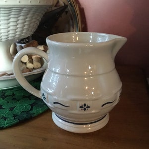 Longaberger Pottery Pitcher (Blue) and Blue Jar with Boyds Bear Topper -  Northern Kentucky Auction, LLC