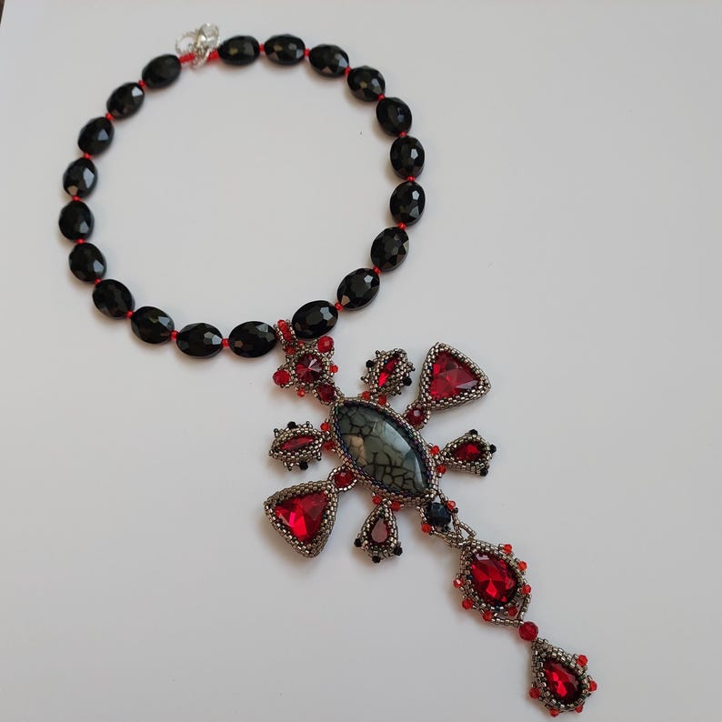 Dark Fashion Jewelry Gothic Cross Pendant Dragon Veins Agate Stone Necklace Red Crystal Setting Silver Metal Accessory Alternative Gothic Style Statement Piece Unique Design Natural Gemstone Pattern Edgy Collection Perfect Gift Alternative