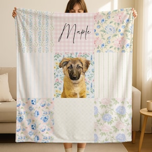 May include: A patchwork blanket featuring a dog portrait, floral patterns, and the name "Maple" in script. The blanket combines various pastel designs, including blue and pink roses, stripes, and gingham, creating a cozy and personalized aesthetic.