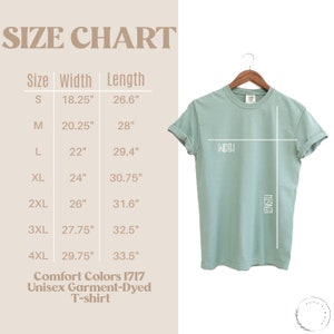 May include: Size chart for a unisex garment-dyed t-shirt. The chart shows the width and length measurements in inches for sizes S through 4XL.