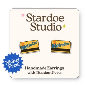 May include: Handmade earrings featuring miniature MetroCard designs. The earrings are nickel-free and have titanium posts. The image includes the text "Stardoe Studio" and "Handmade Earrings with Titanium Posts."