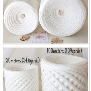 May include: Two white yarn balls, one measuring 50 meters (54.6 yards) and the other 100 meters (109 yards). The yarn is a thick, chunky texture. The yarn balls are sitting on a white surface.