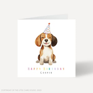 May include: A birthday card featuring a watercolour illustration of a beagle wearing a colourful party hat. The text "Happy Birthday Cooper" is written in rainbow colours below the dog.